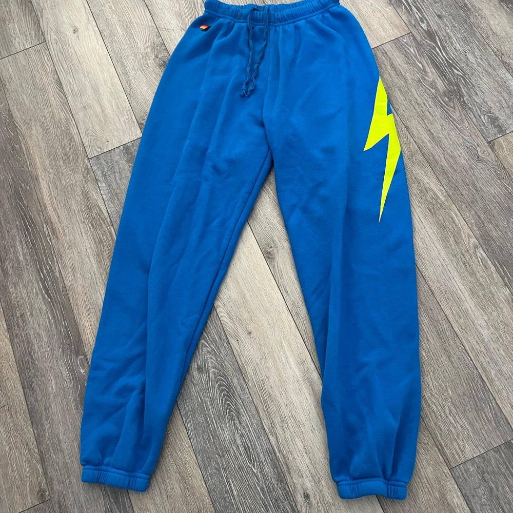 Aviator Nation Blue Track Joggers with Neon Yellow Lightning Bolt